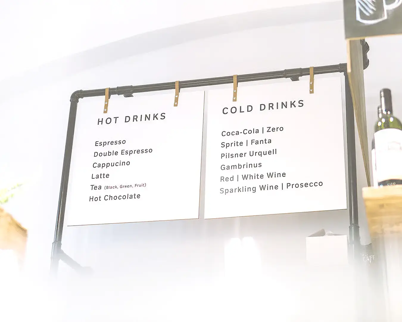 Diners reviewing a restaurant menu, highlighting typography and menu design
