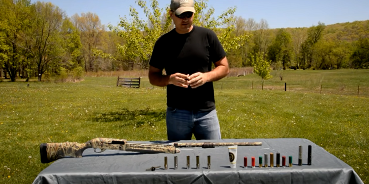 man watching chokes gun and pallets placed on table
