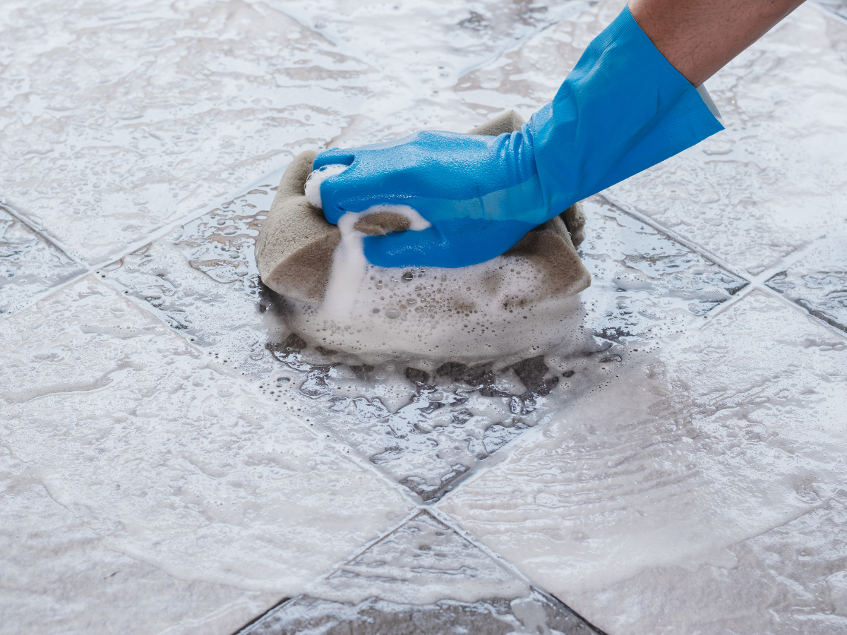 A person preparing for a professional tile and grout cleaning