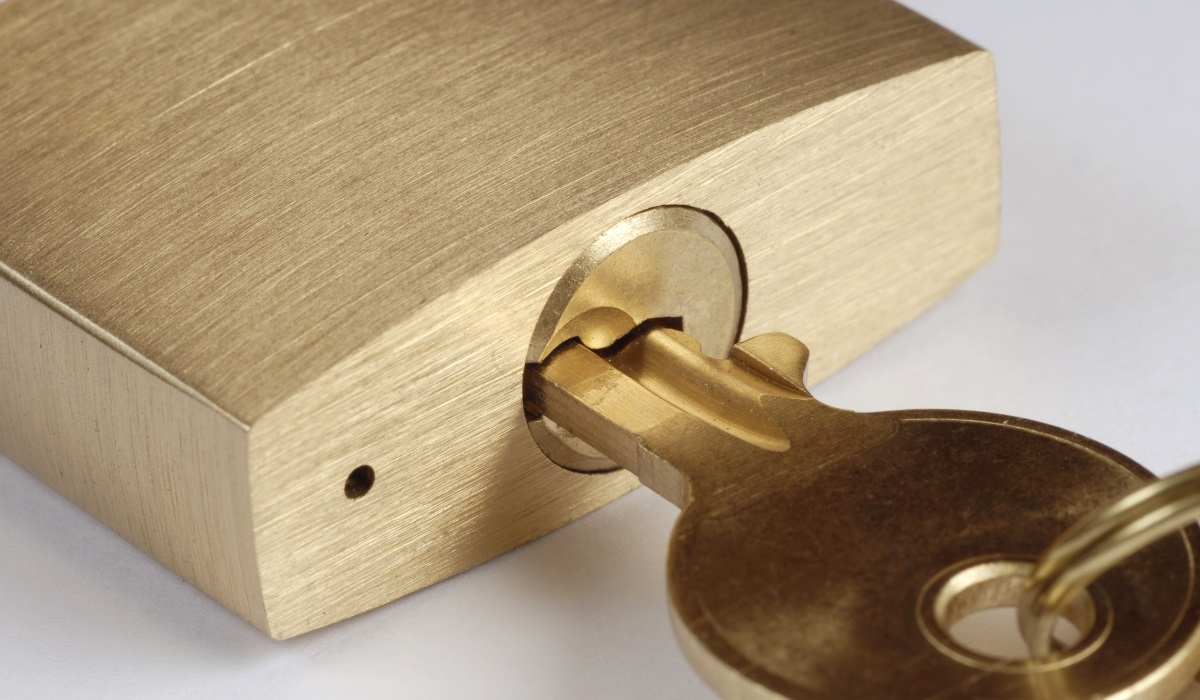 Small brass lock with key - typical of major padlock manufacturers 