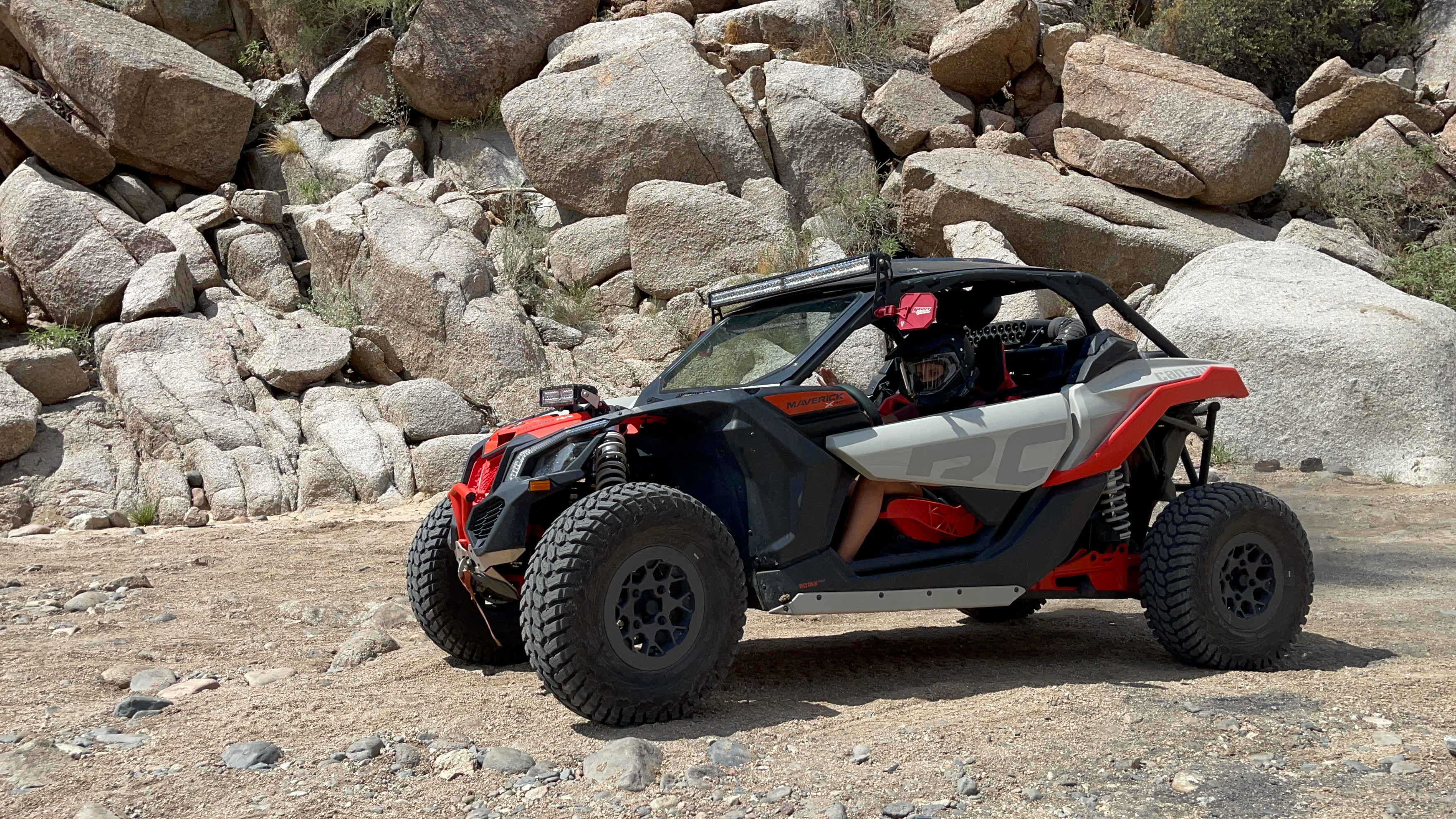 A group of people riding ATVs in the Arizona desert