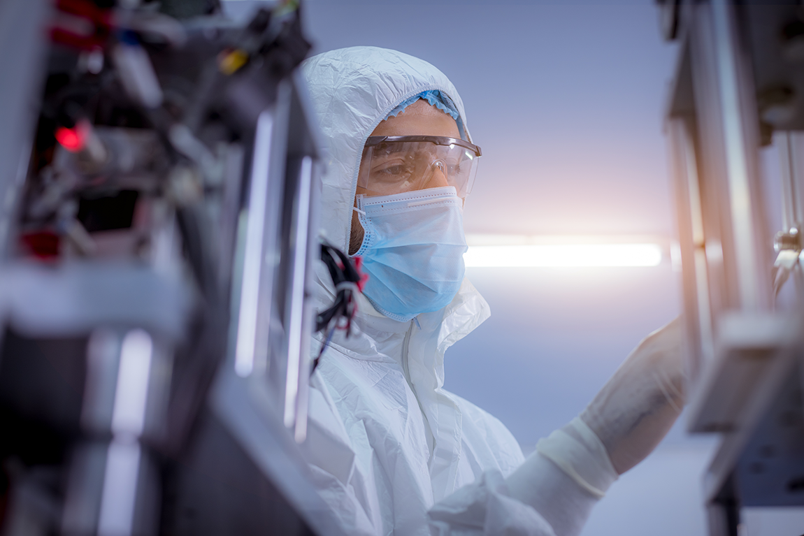 Picture-of-man-in-coveralls-in-the-lab