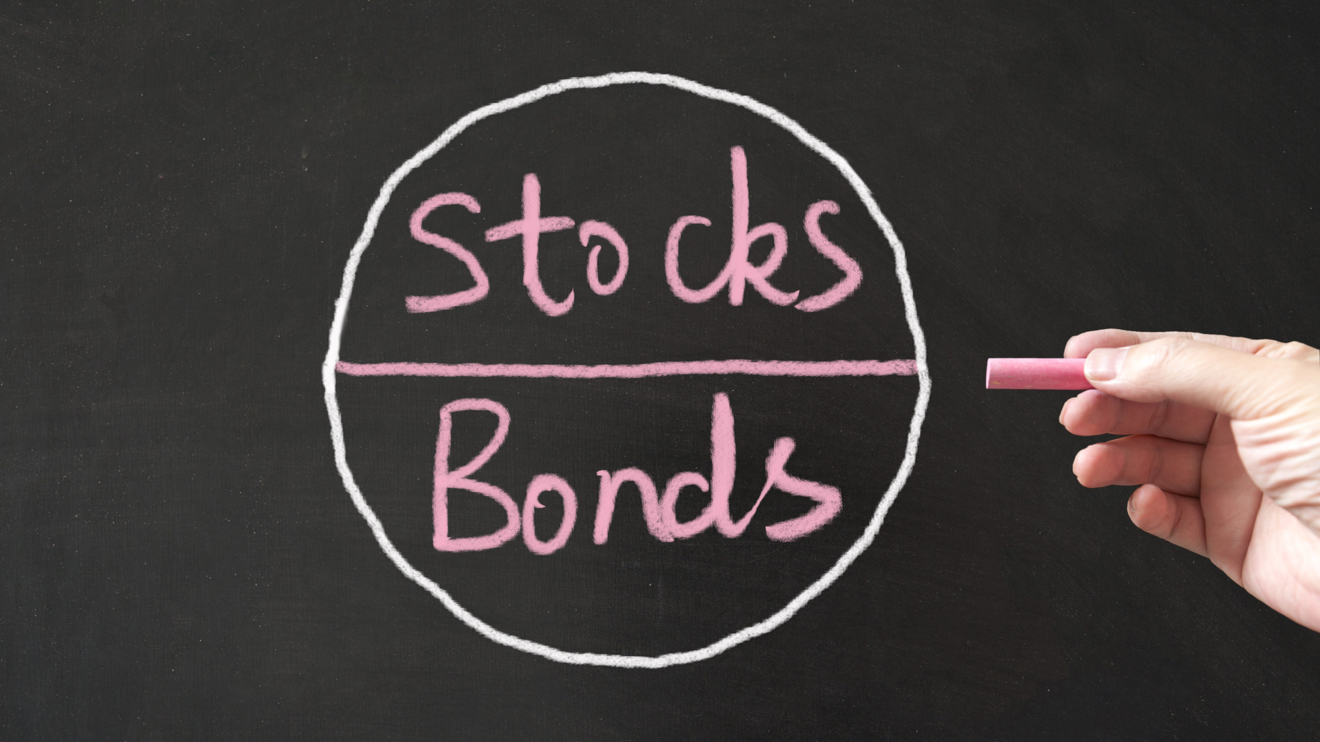 chalk writing on a blackboard with 'stocks' and 'bonds' on