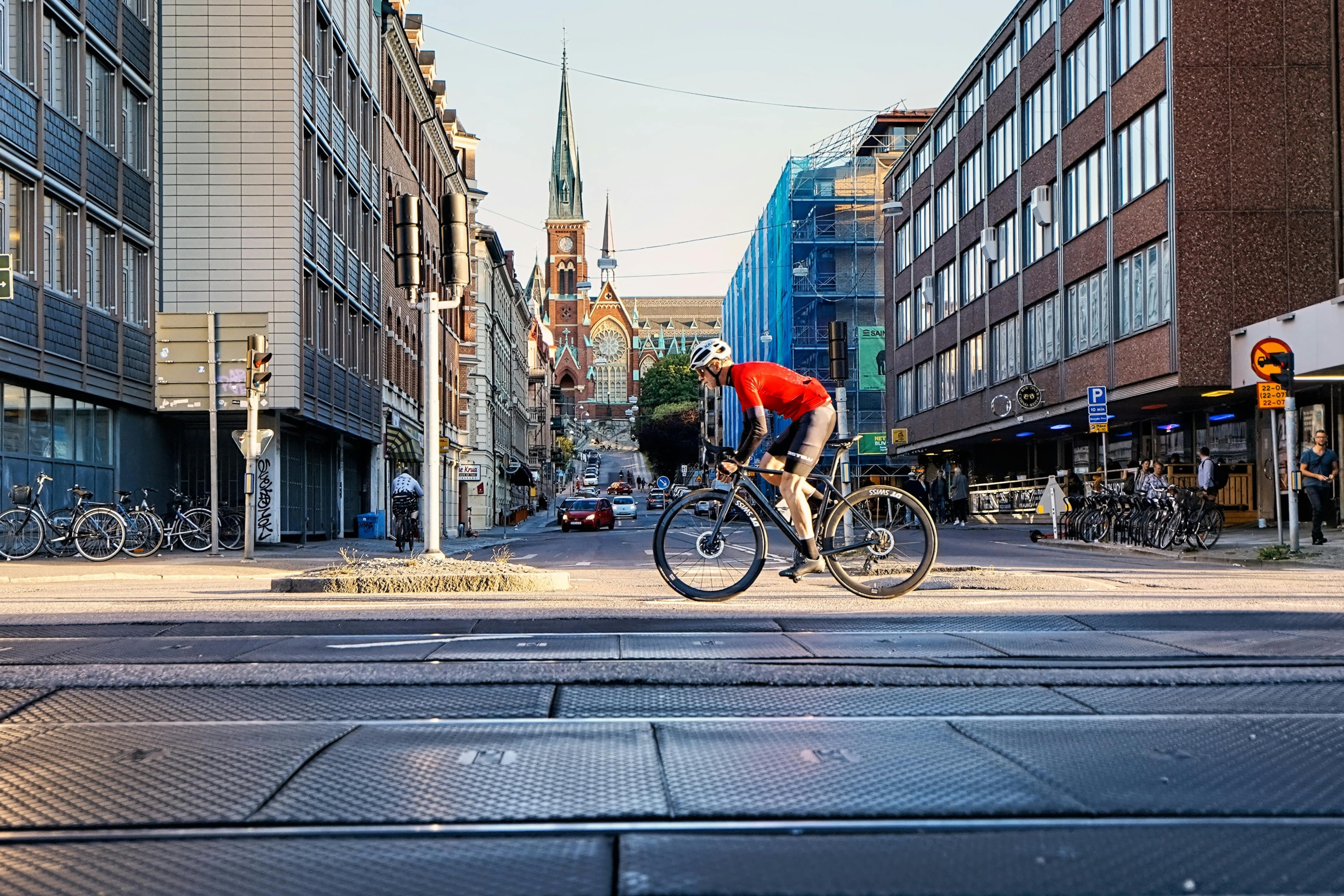 Photo by Martin Magnemyr: https://www.pexels.com/photo/man-in-red-shirt-riding-bicycle-on-road-5270058/