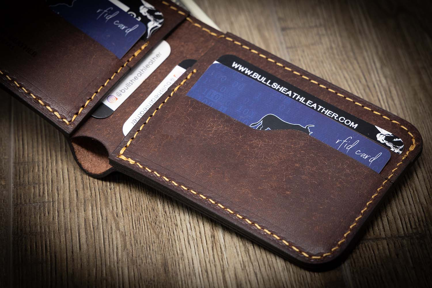 A leather bifold wallet with card slots and a cash pocket.
