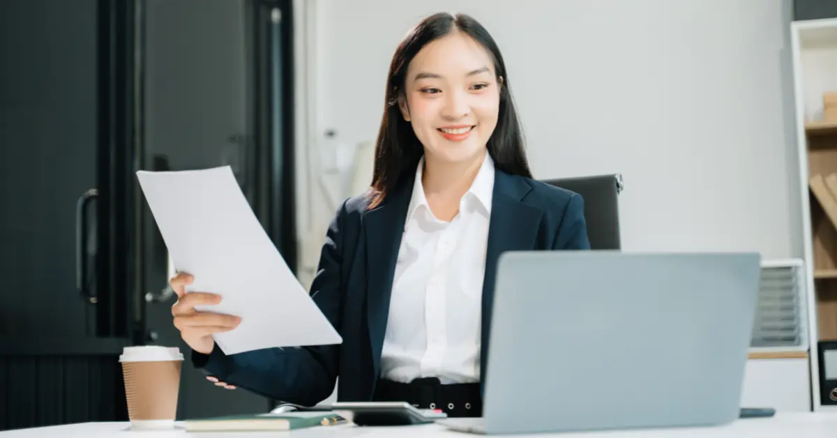 Woman reviewing business finances to understand owner distributions.