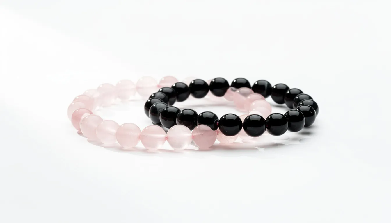 The image features elegant minimalist beaded bracelets made from rose quartz and black onyx, displayed against a pristine white background. These stunning jewelry pieces showcase a simple yet sophisticated design that highlights the beauty of the beads.