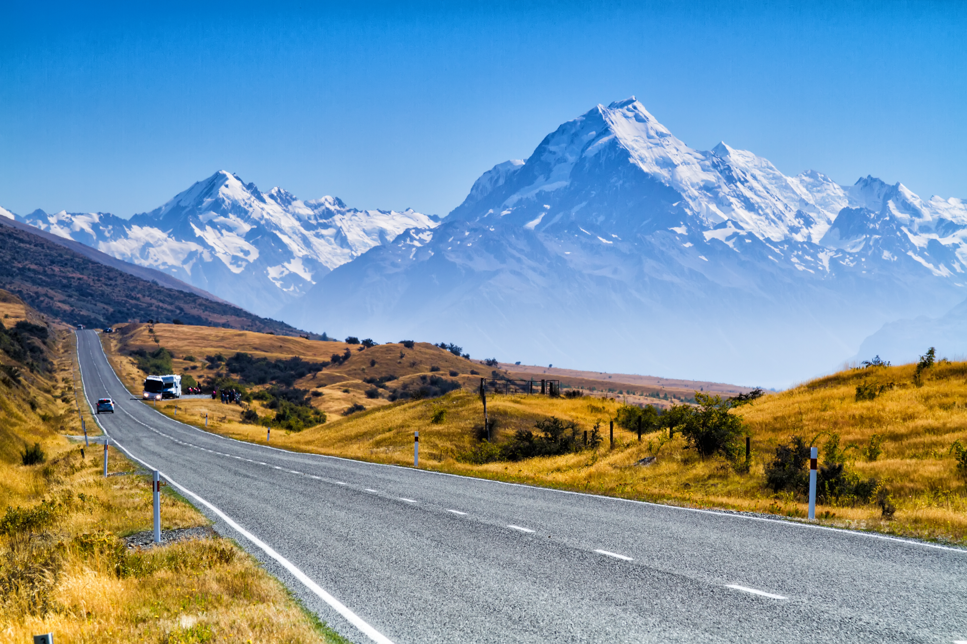 View of the majestic Aoraki Mount Cook with the road leading to Mount Cook Village, New Zealand
