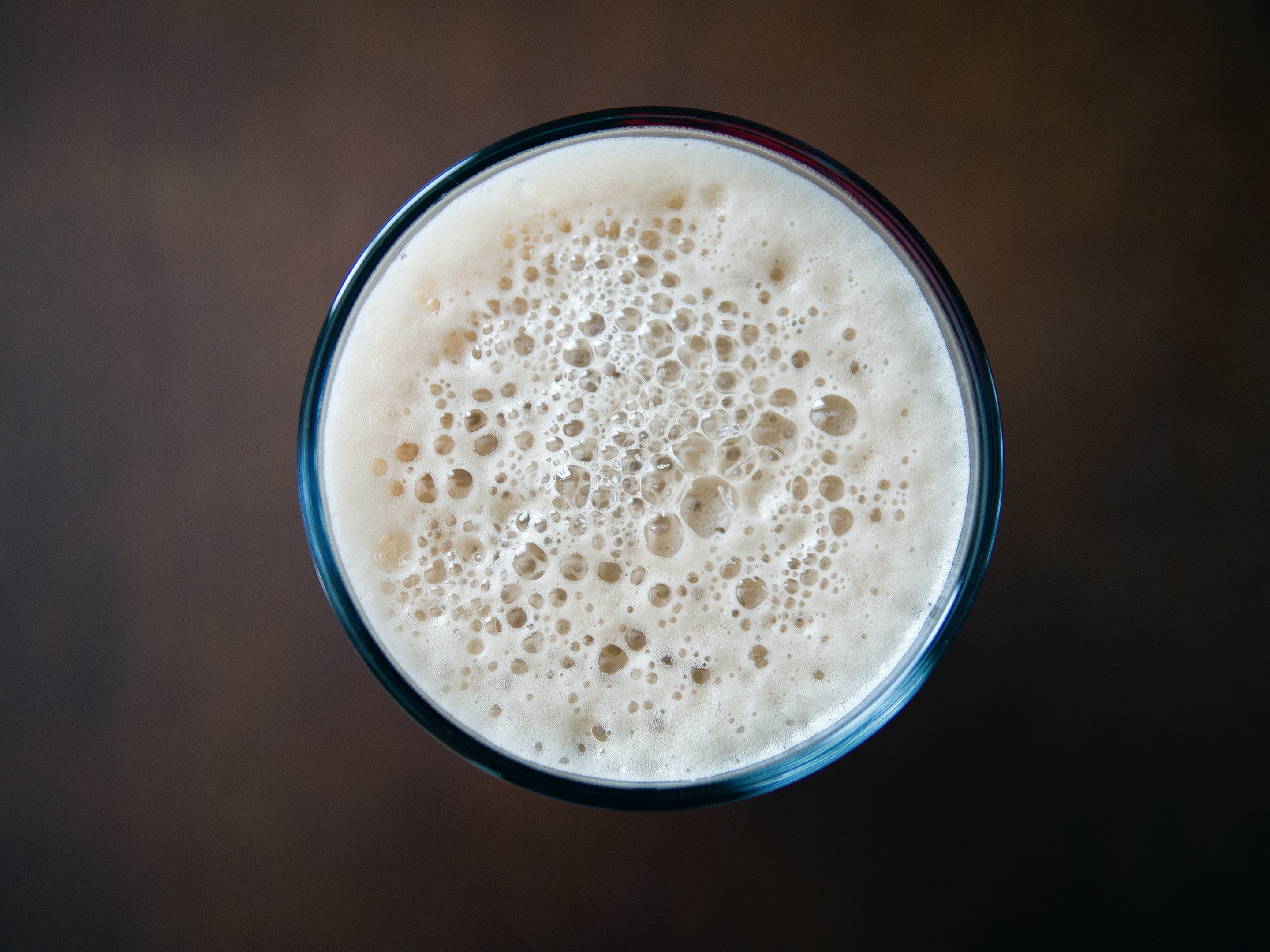 milk on glass, the top of a foamy milk.