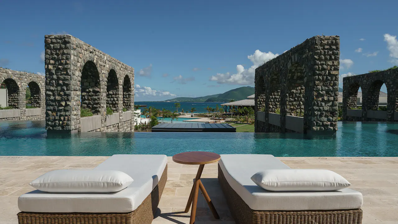 two chairs overlooking the pool of park hyatt st kitts