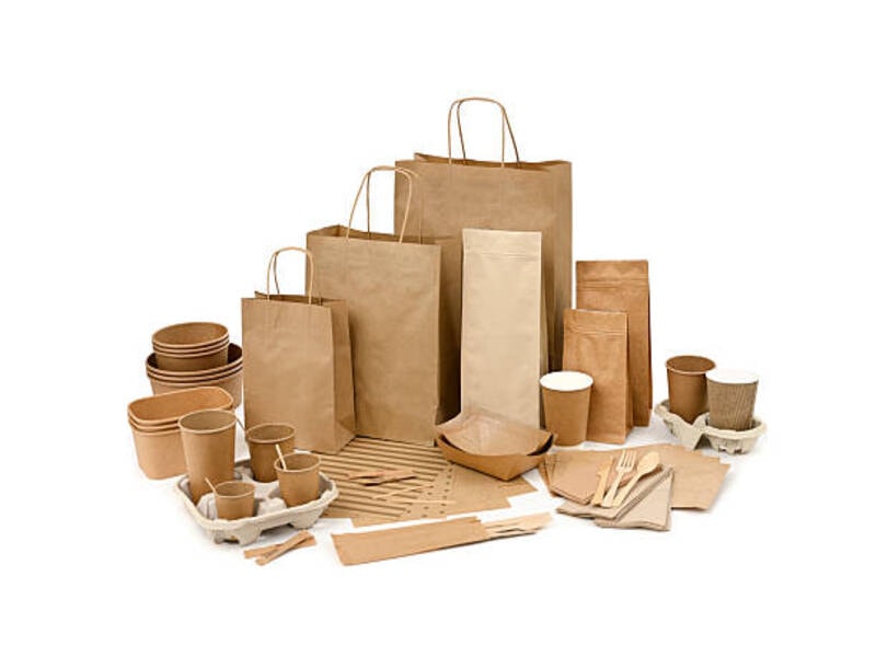 Different sizes of brown paper bags along with various paper-made products. 