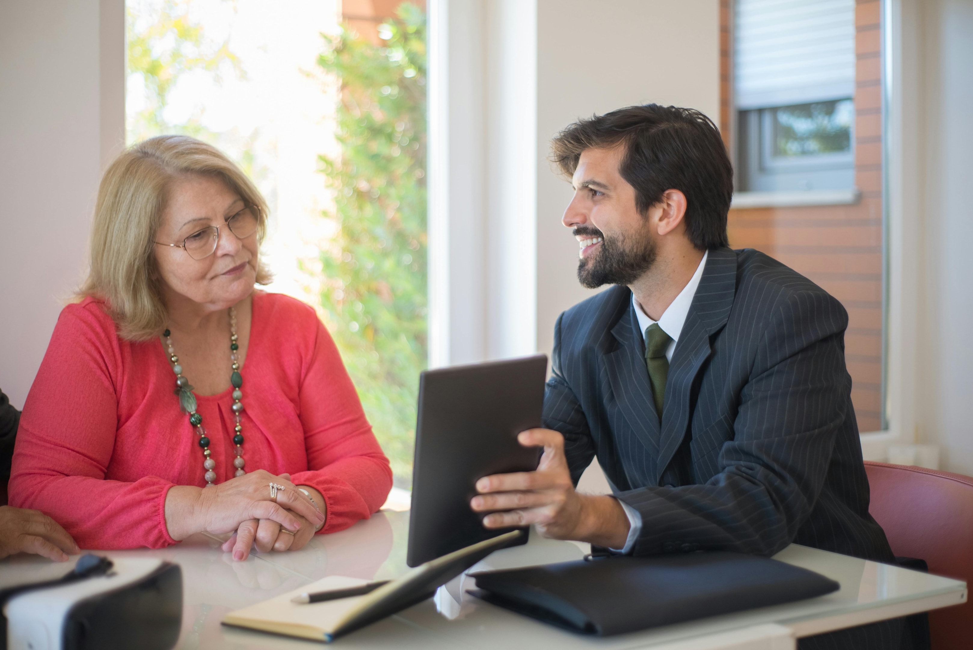 Real estate investor meets with long-term property owner to discuss selling the property.
