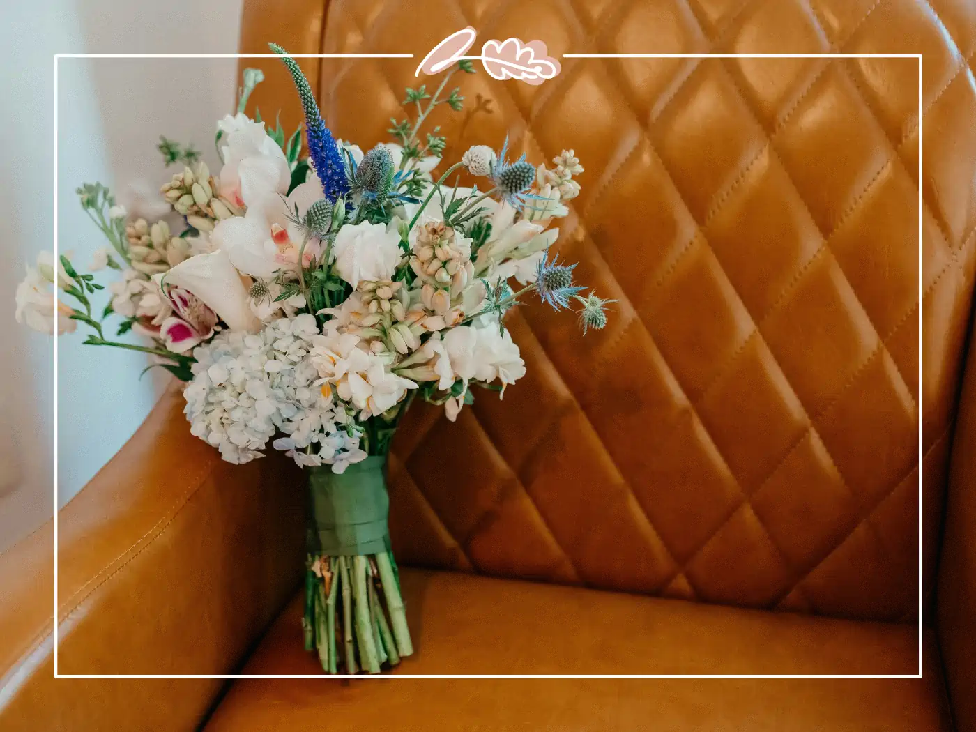 Bouquet of white and blue flowers on a brown leather chair, Fabulous Flowers and Gifts