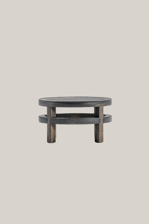 Low round Japanese coffee table in dark wood with layered circular surfaces and sturdy vertical supports.