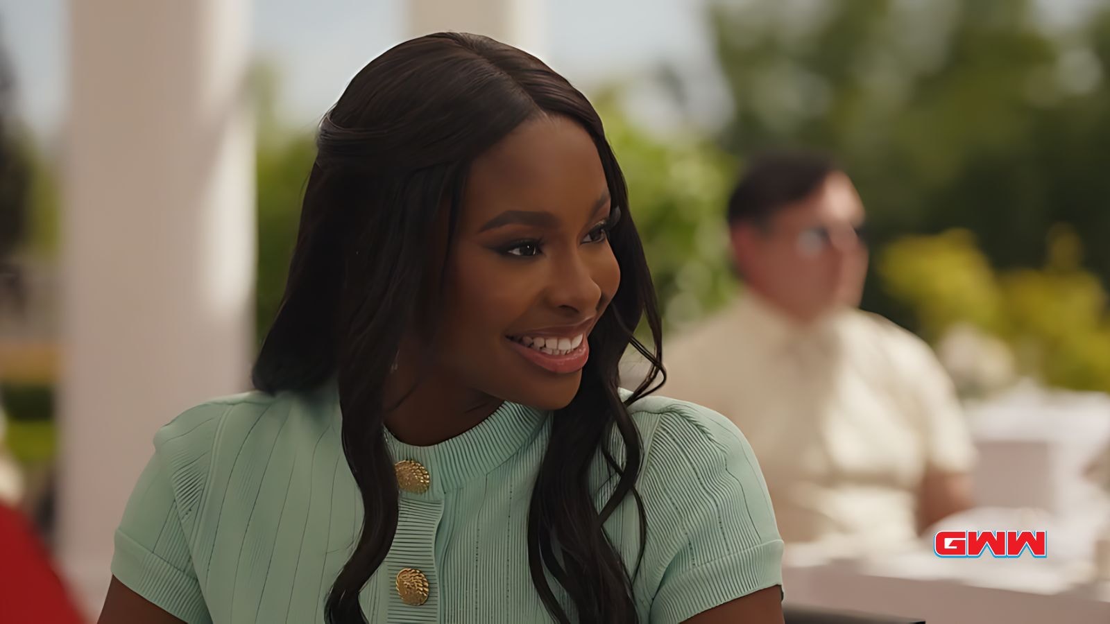 Coco Jones smiling during outdoor conversation in Bel-Air Season 4 scene