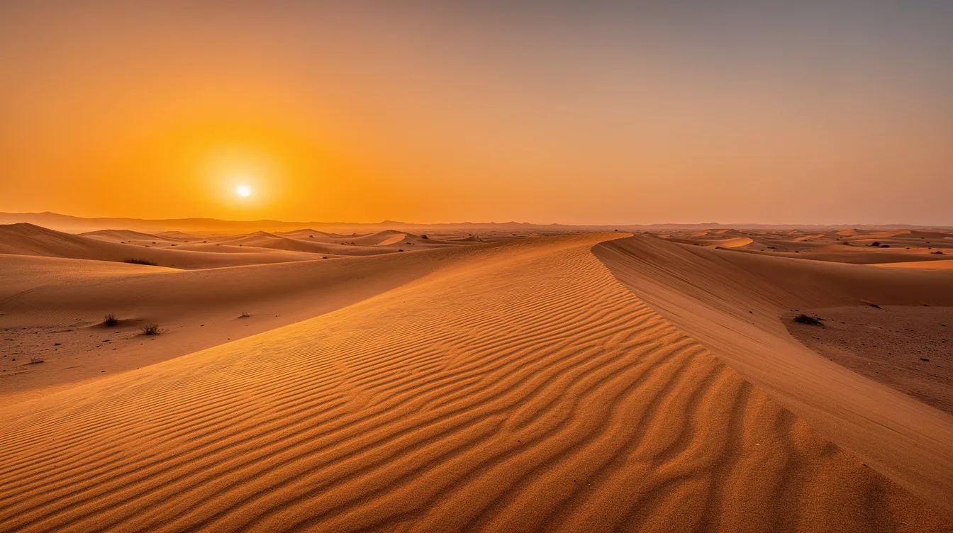 Atardecer sobre las dunas doradas del desierto marroquí, donde las sombras se alargan y el cielo se tiñe de un vibrante anaranjado, creando un paisaje deslumbrante ideal para un viaje en coche por Marruecos. Este entorno natural resalta la belleza del país, perfecto para quienes buscan alquilar un coche y explorar sus maravillas.