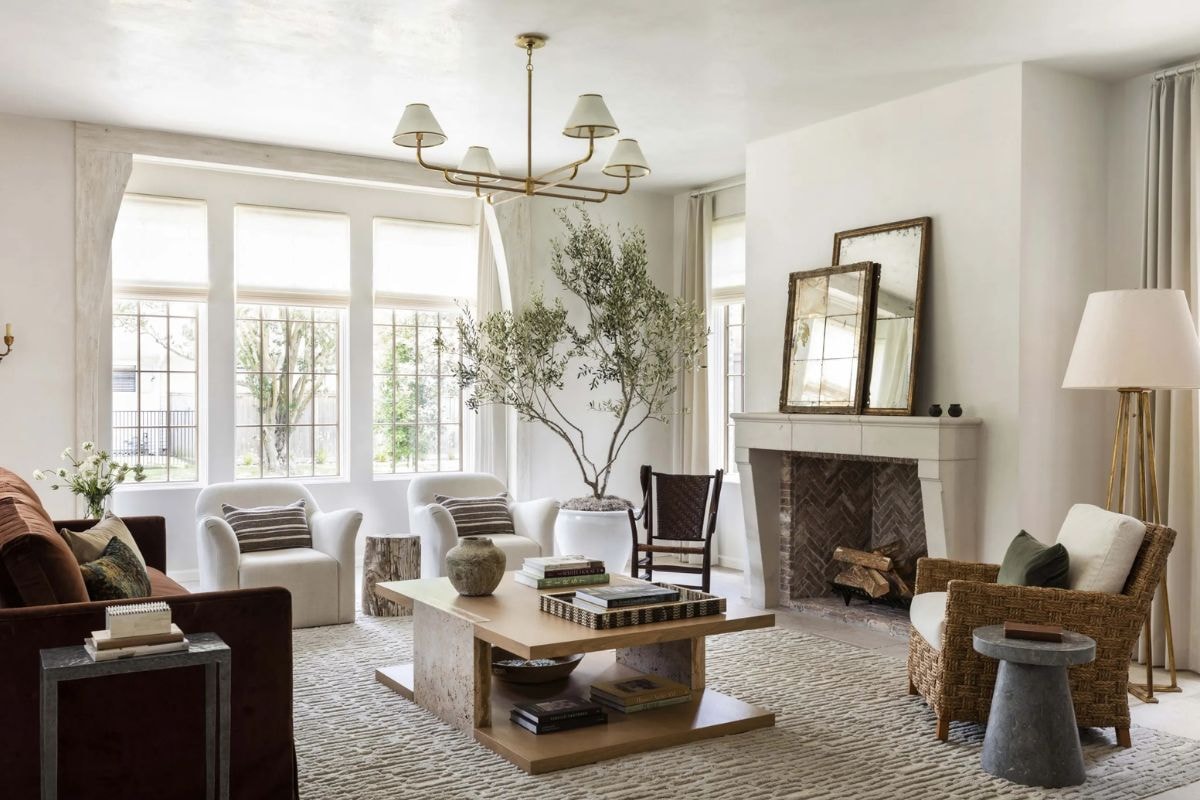 Elegant home office with the Hudson Valley Lighting Glimmer chandelier hanging above a dark wood desk and built-in white shelving.