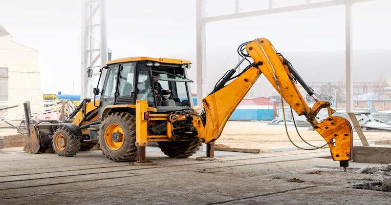 Backhoe loader with hydraulic hammer.