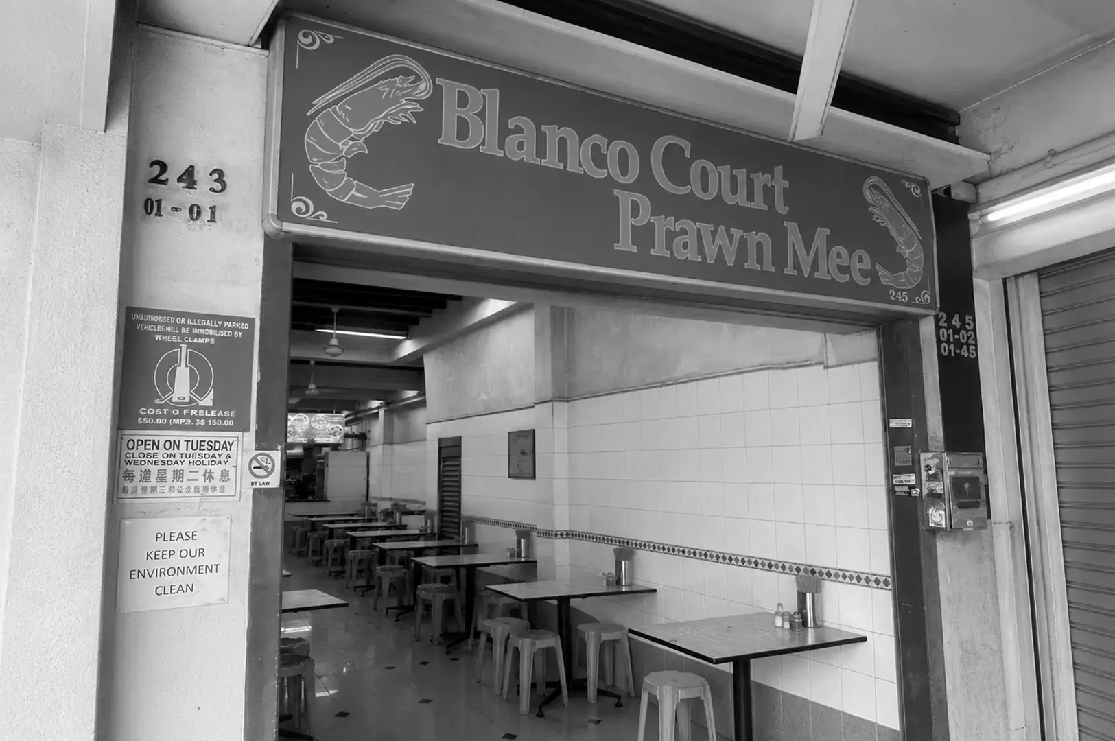 Entrance of Blanco Court Prawn Mee with simple outdoor seating.