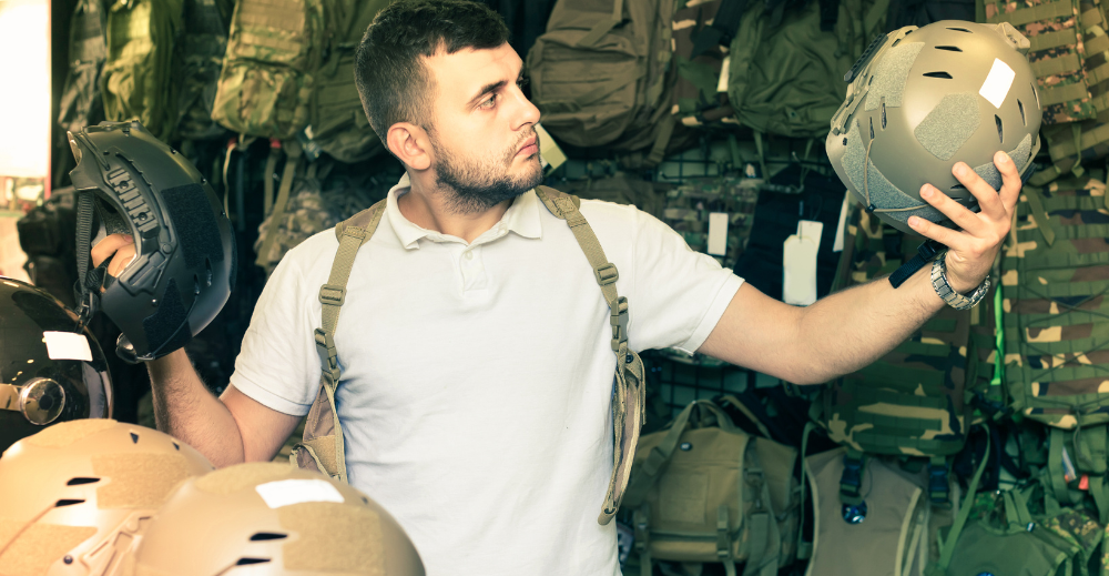 man comparing  helmets