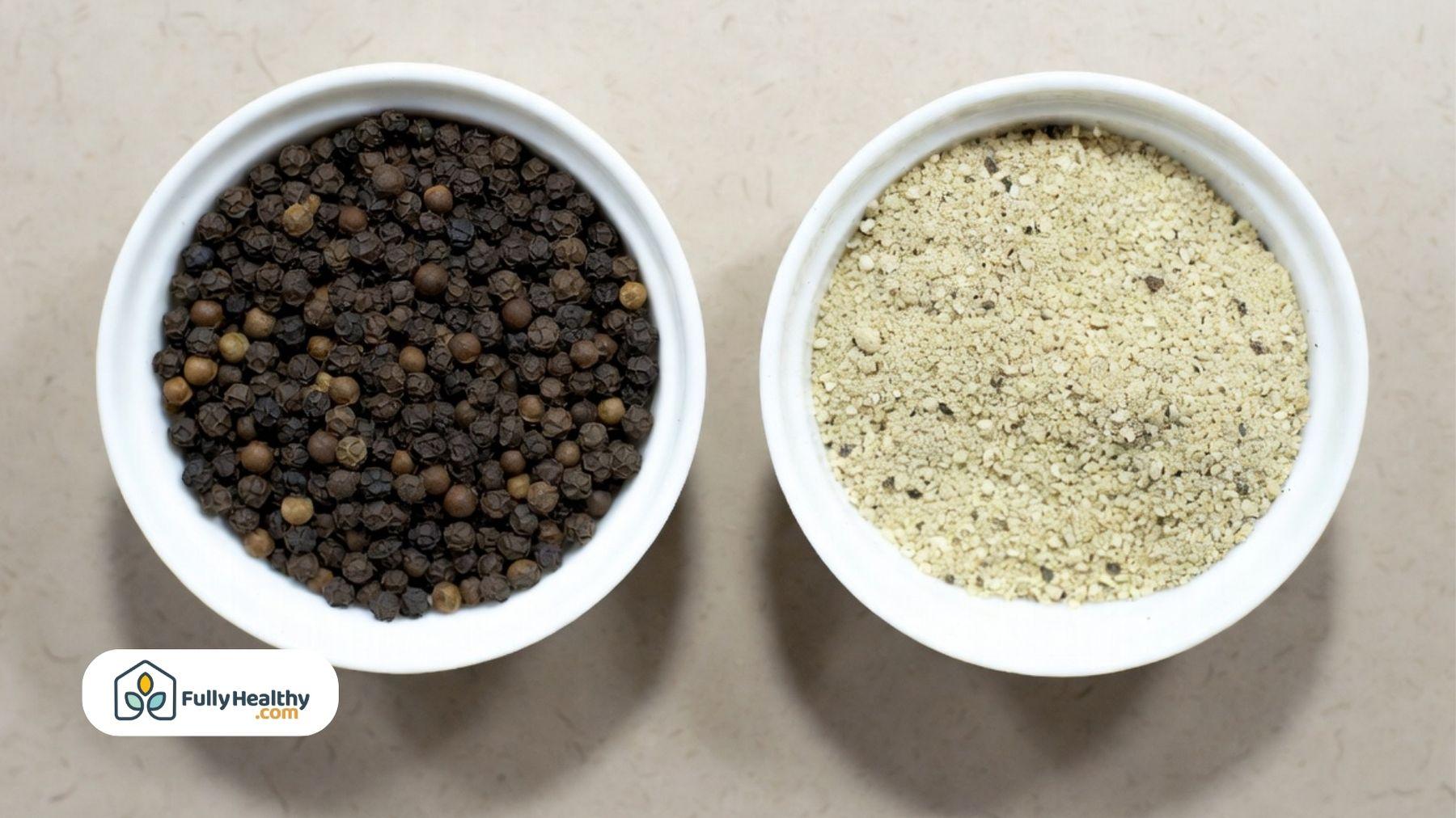 Side-by-side bowls of whole black peppercorns and finely ground pepper.