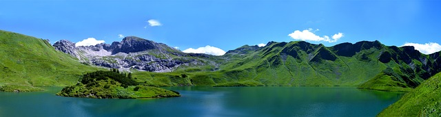 Outdoor Adventures lake in front of mountains