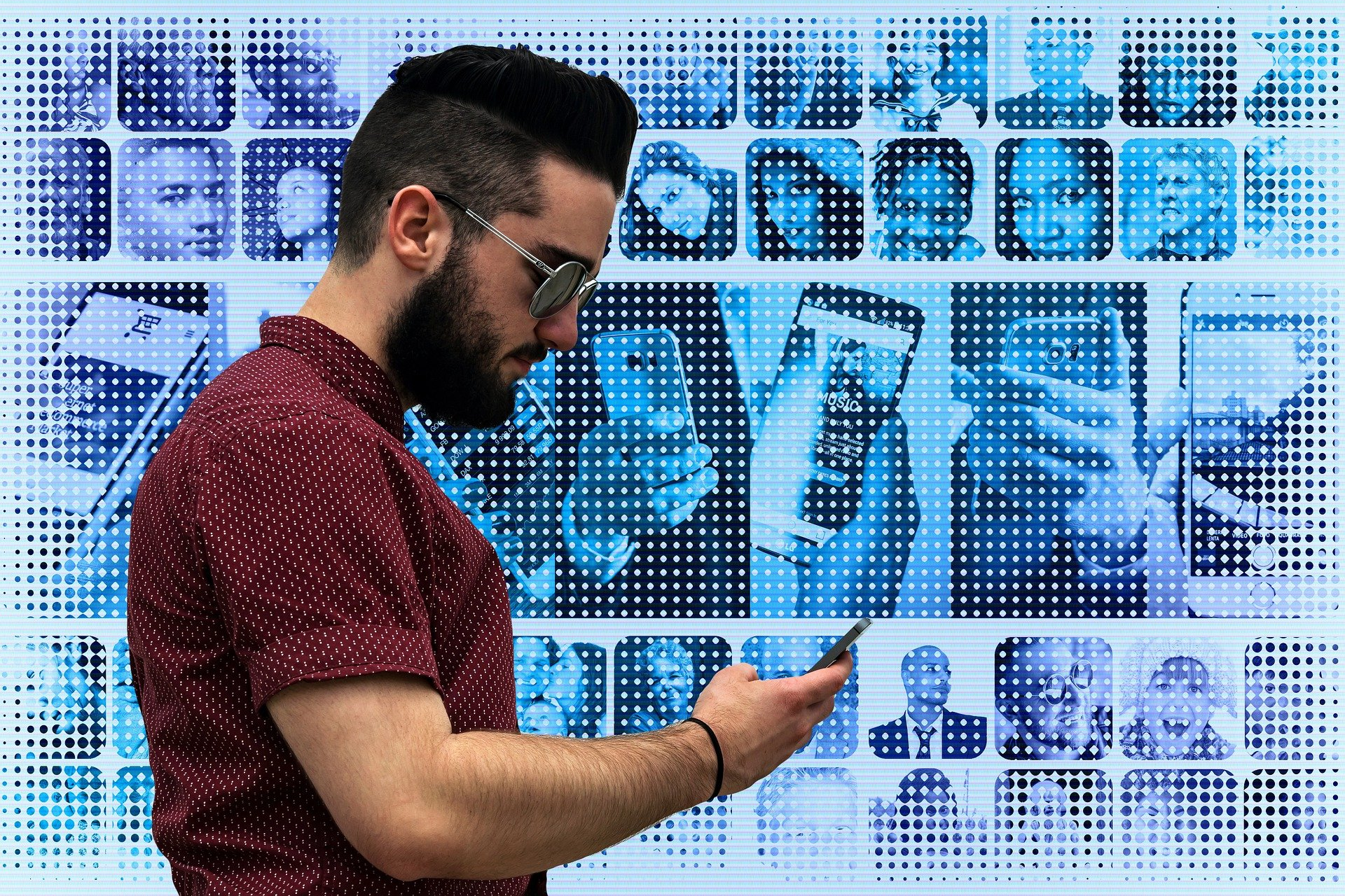 Man on mobile phone with pixalated image of phone screens behind him 