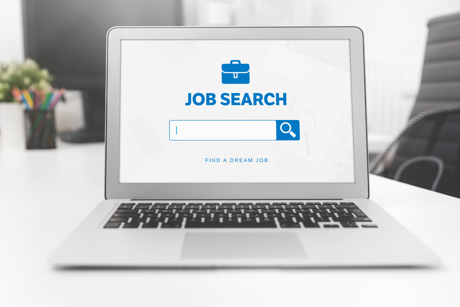 A laptop showing Job Search on the screen.