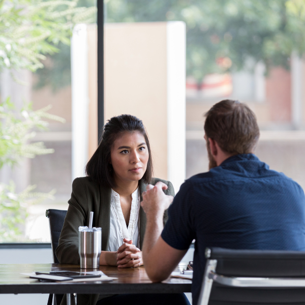 An image showing a person consulting with a Birmingham truck accident attorney.