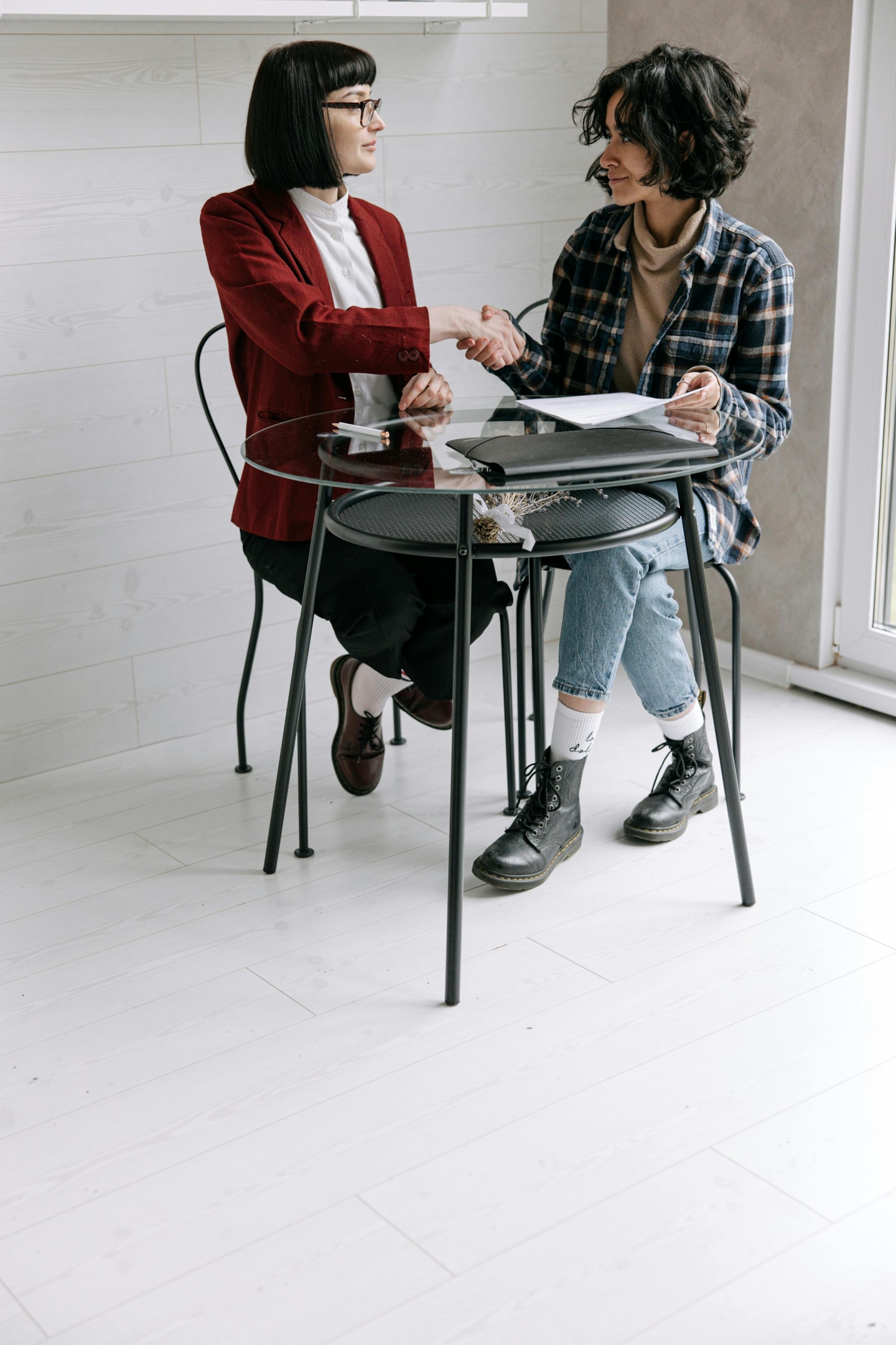 Real estate investor meets with heir of probate property to discuss selling options.