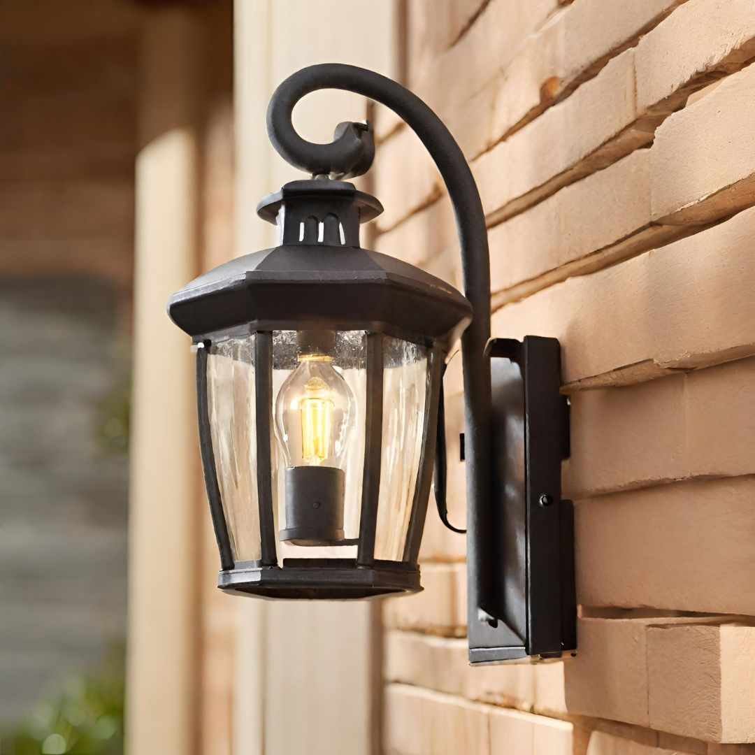 An exterior wall light lantern shaped with sensor mounted on a wall.