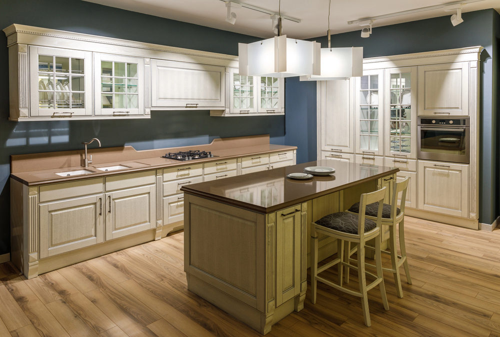 Custom kitchen with white cabinetry and center island illustrating frame vs frameless cabinets for an Orlando kitchen remodel.