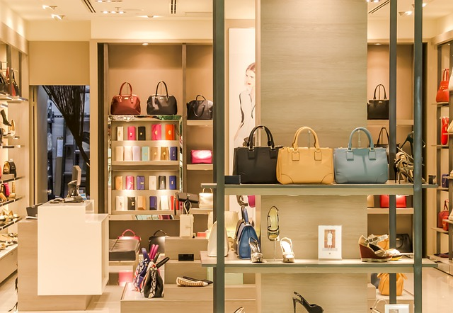A storefront with several shoe and bag options. Retailers and brands with a lot of SKUs rely on Product Information Management (PIM) to run their businesses efficiently.