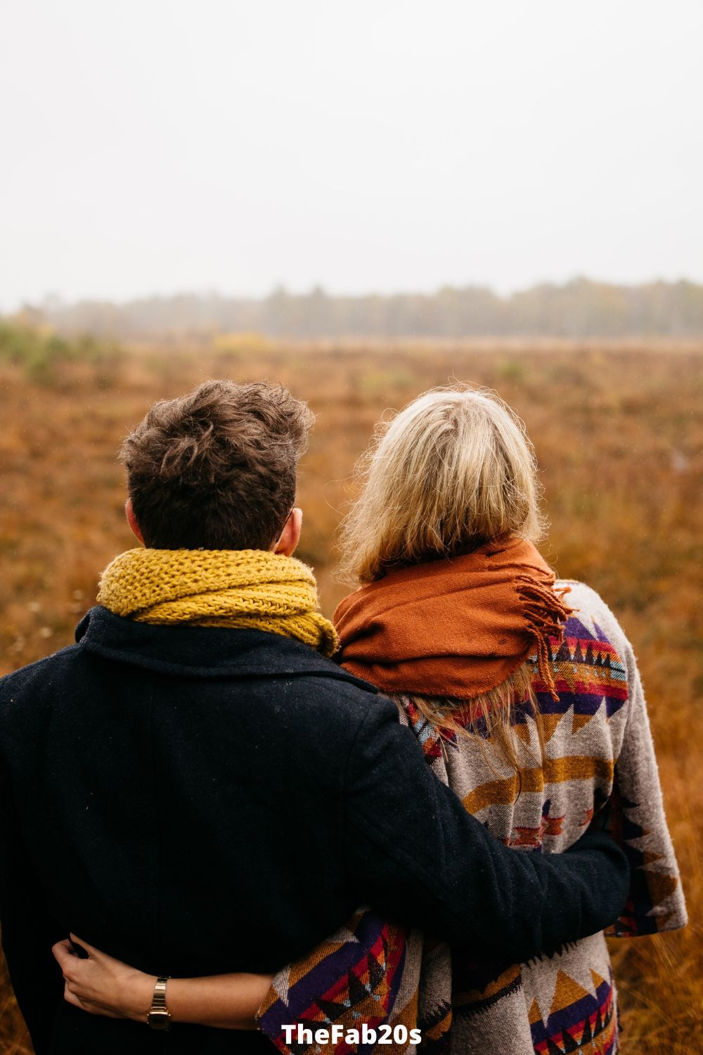 Scorpio woman and Gemini Man embracing while looking over a field - Featured In Why Are Geminis Attracted To Scorpio