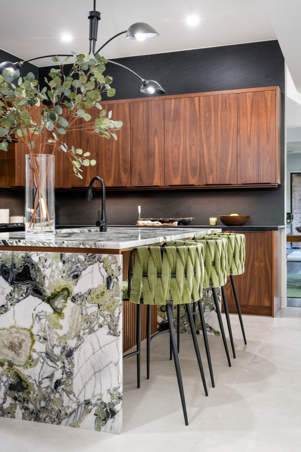 This kitchen is the perfect mix of color, texture, and edge with green, brown, and charcoal finishes.
