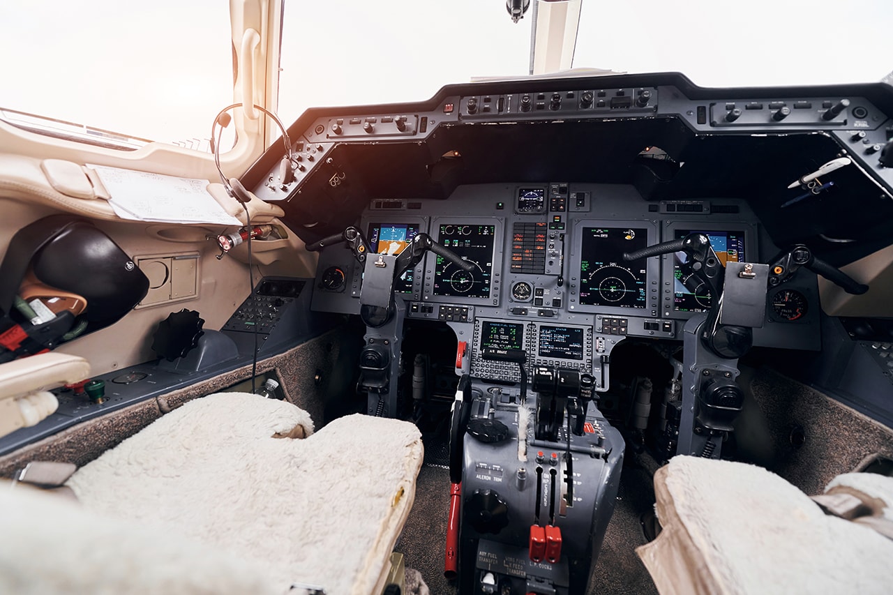 A student pilot in an aircraft cockpit during a flight training session.
