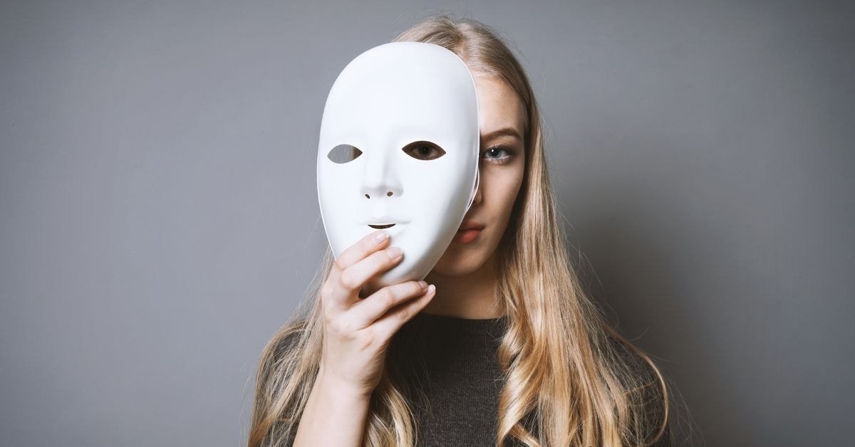 Woman holding a mask, representing common OnlyFans tax mistakes made by creators.