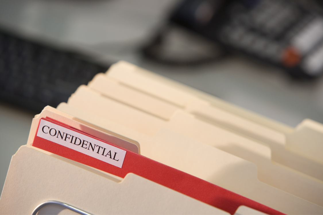 Confidential folder containing sensitive business sale documents typically included in a Confidential Information Memorandum.