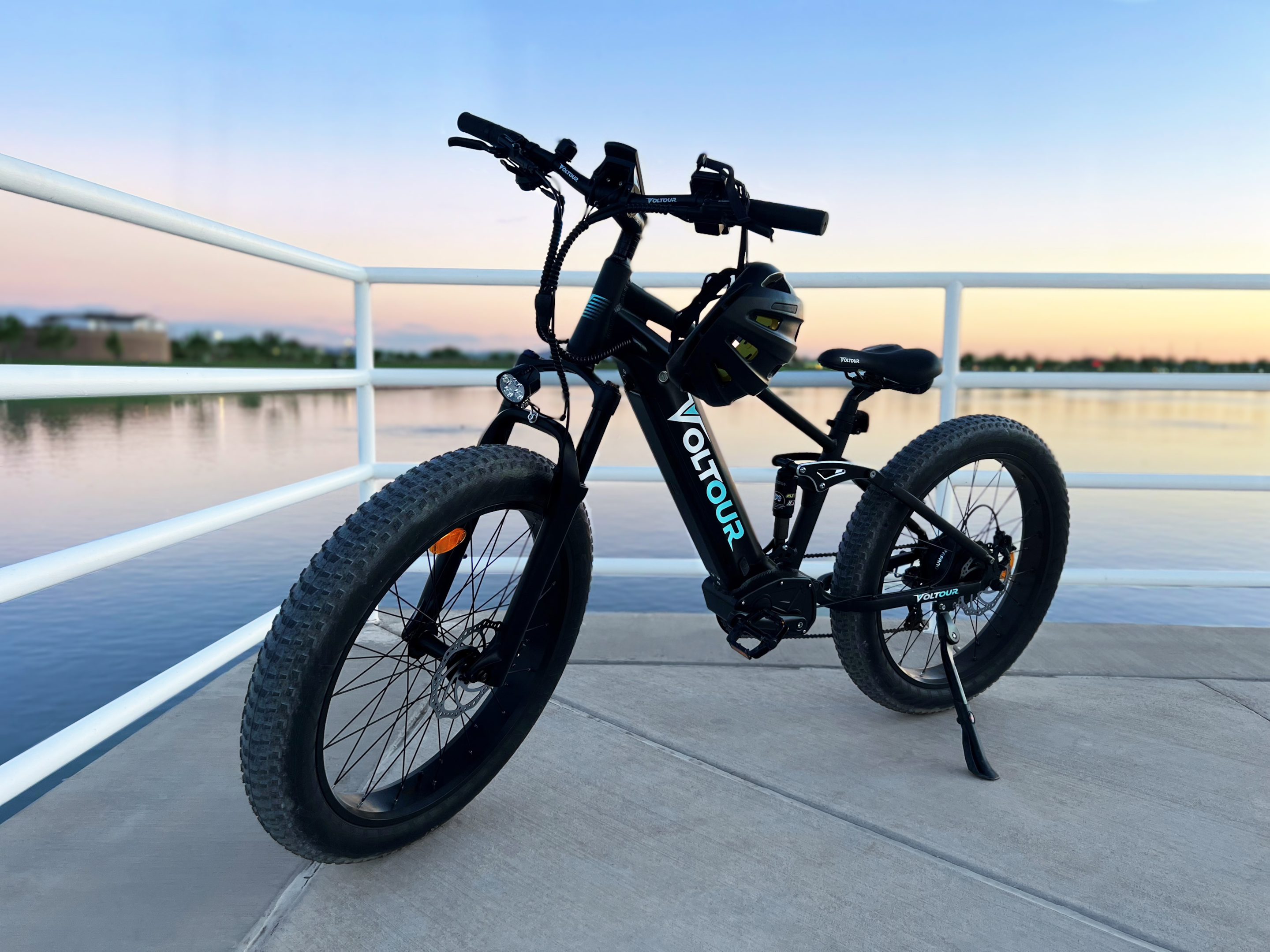 parked ebike in front of water