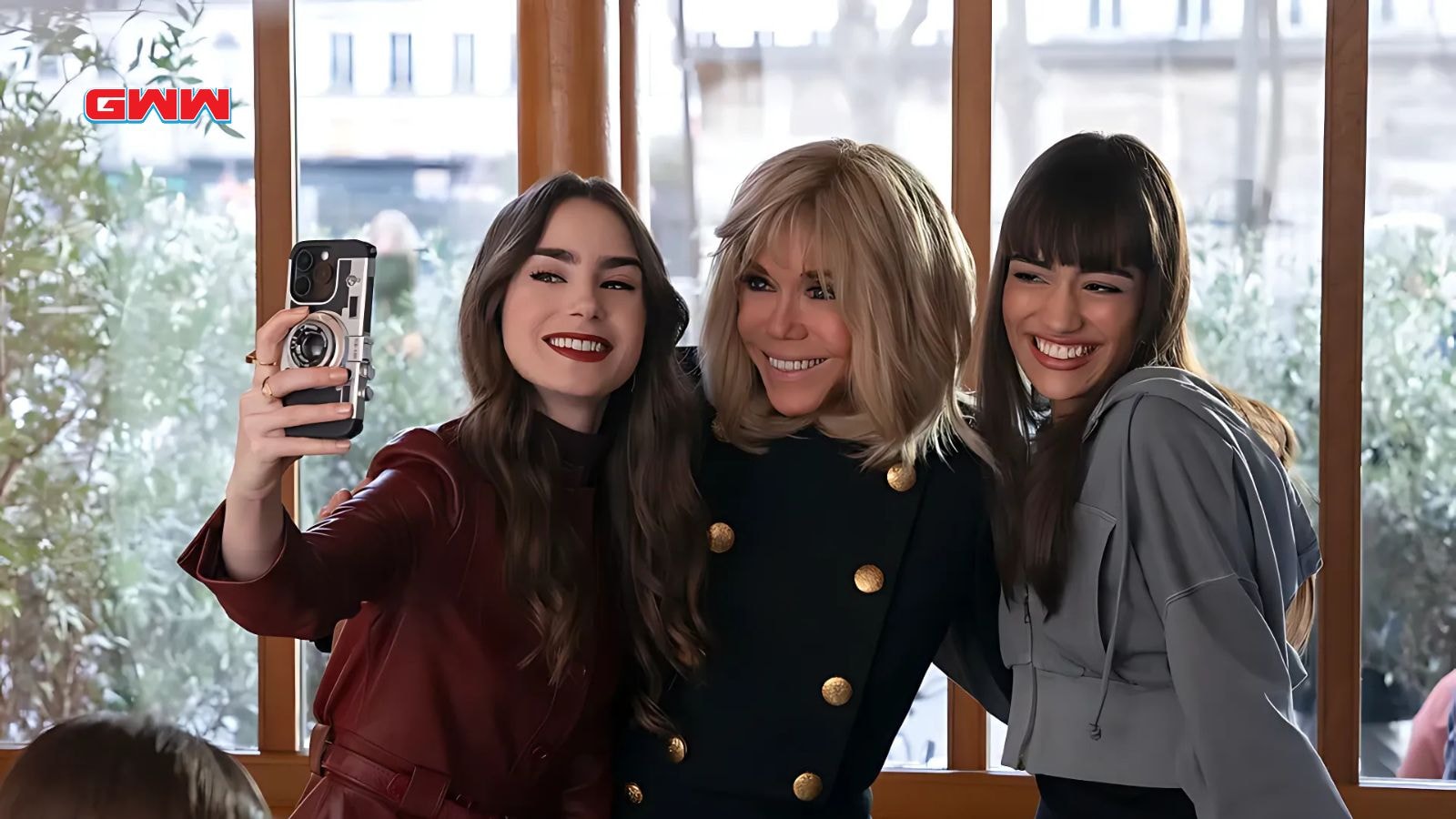 Lily Collins as Emily, Brigitte Macron as herself, and Thalia Besson as Genevieve in Emily in Paris