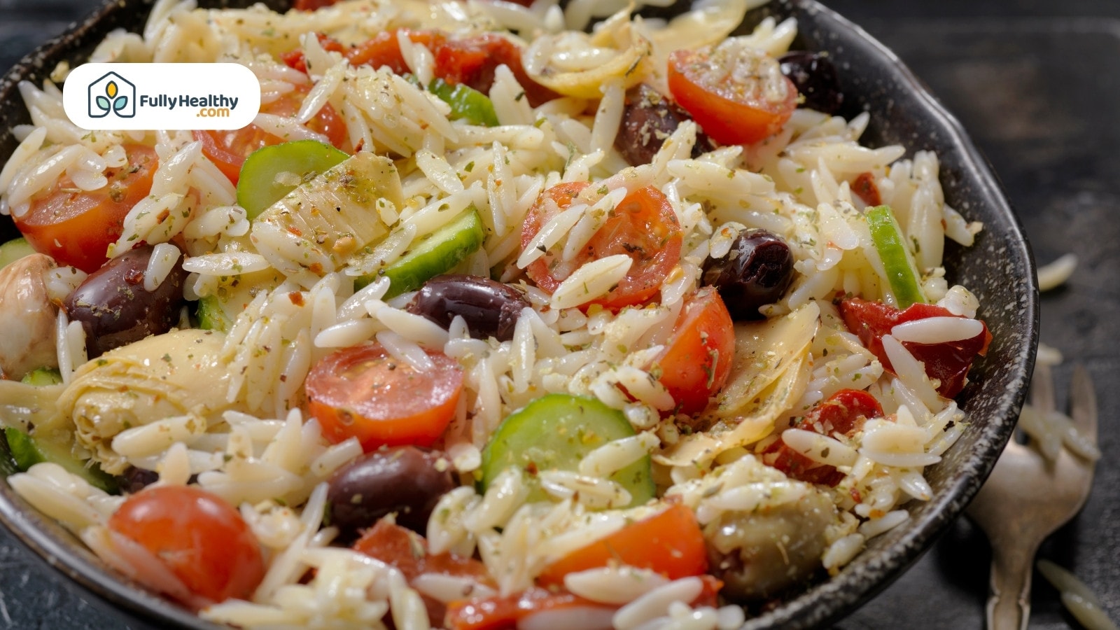 Orzo salad with cherry tomatoes, olives, and artichoke hearts