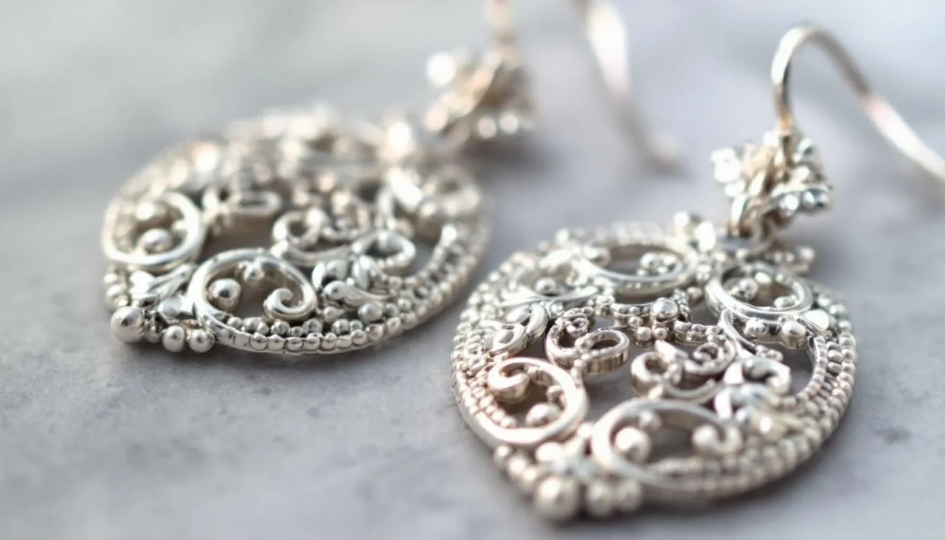 The image features an elegant collection of sterling silver earrings, showcasing various styles and intricate craftsmanship. Each pair reflects a unique beauty and modern design, making them a perfect fashion statement for any occasion.