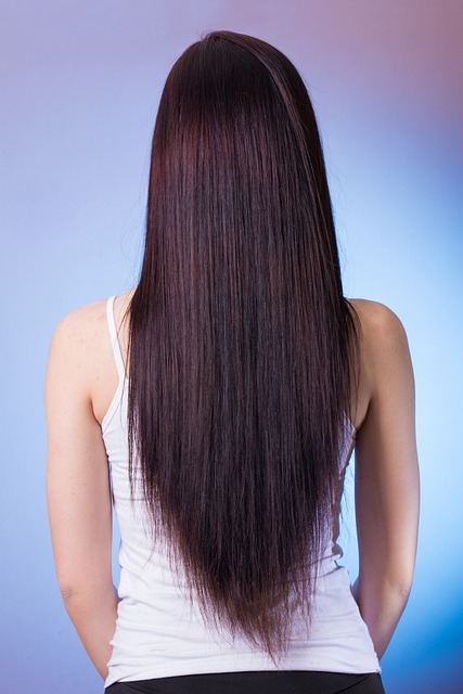 Long, dark haired woman, back view of long straight hair