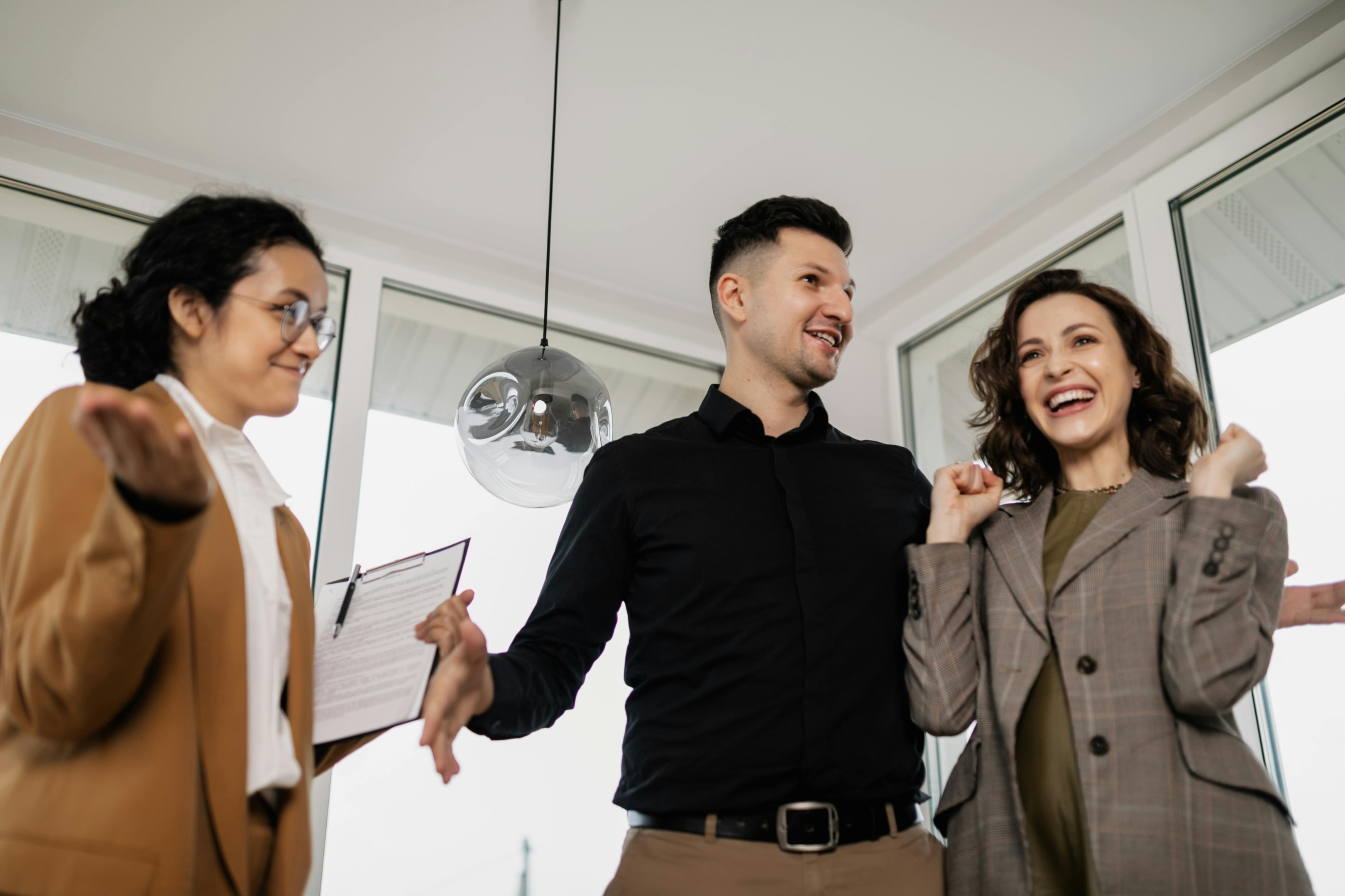 Real estate investor shows property to rental clients.