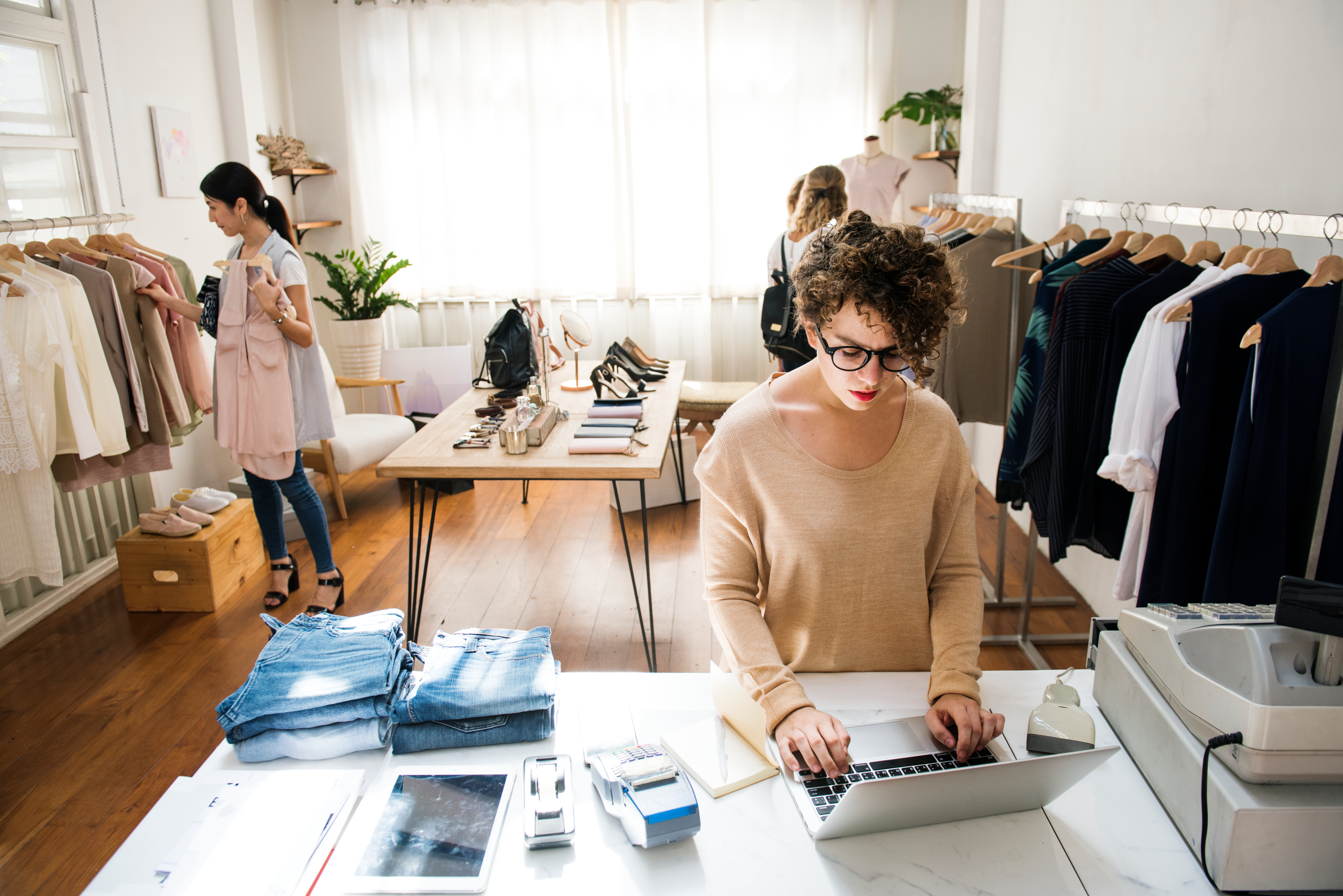 A female business owner valuating her shop's inventory.