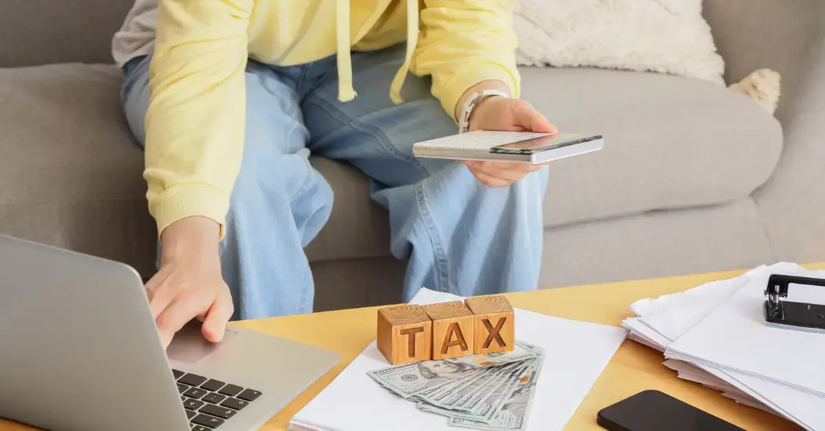Woman reviewing an IRS installment agreement and monthly tax payment options at home.