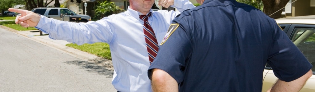 Police officer giving roadside field sobriety test to a driver in Minnesota.