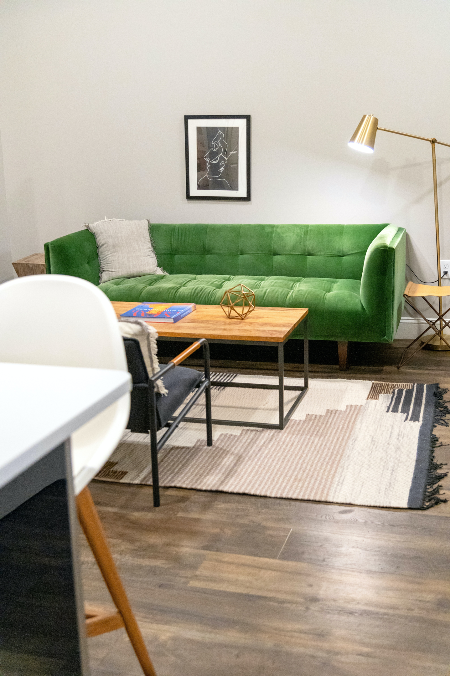 open plan living space using rug to join the kitchen area 