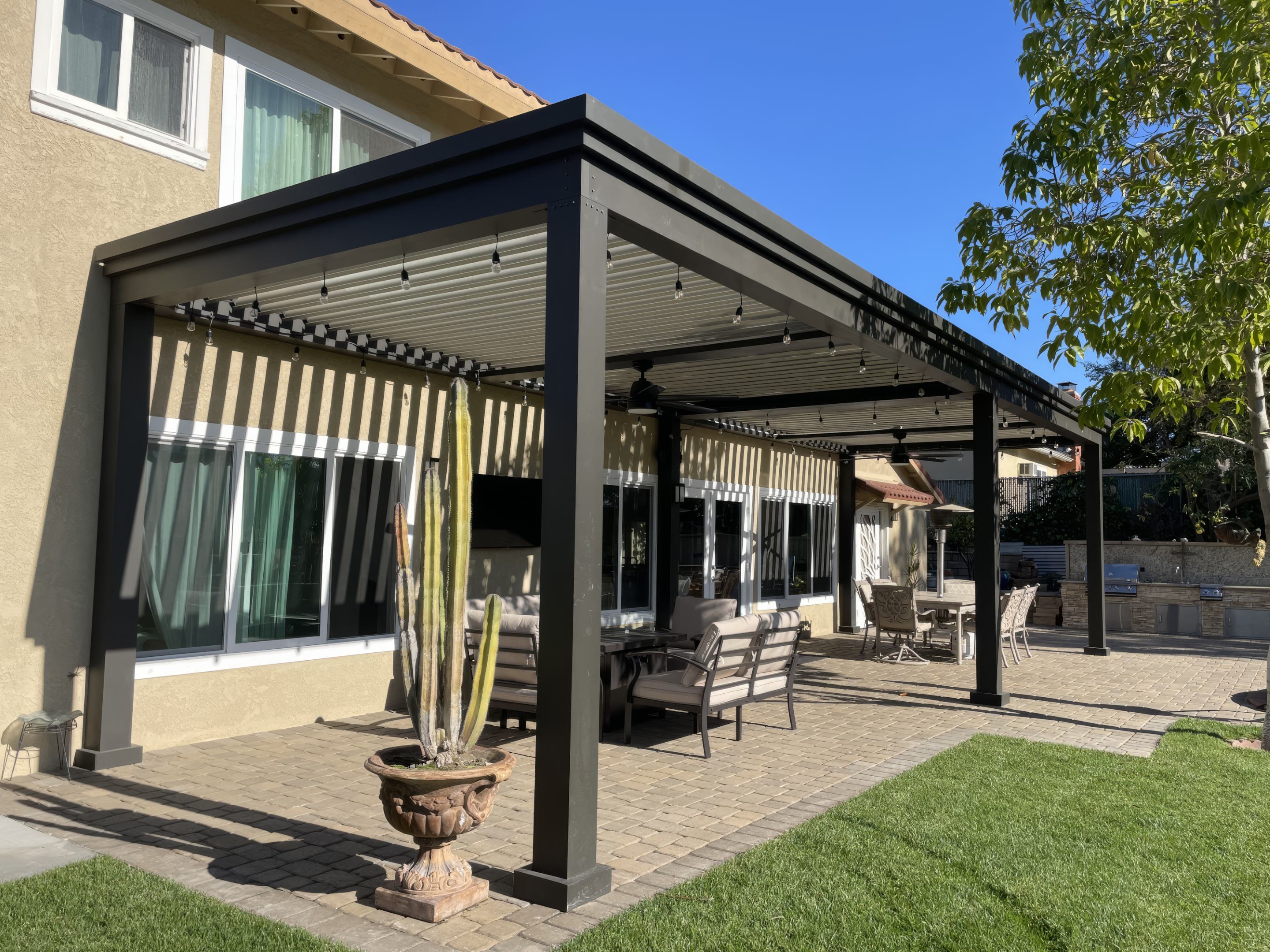 Pergola Structures have come a long way!  Modern, sleek aluminum pergola.