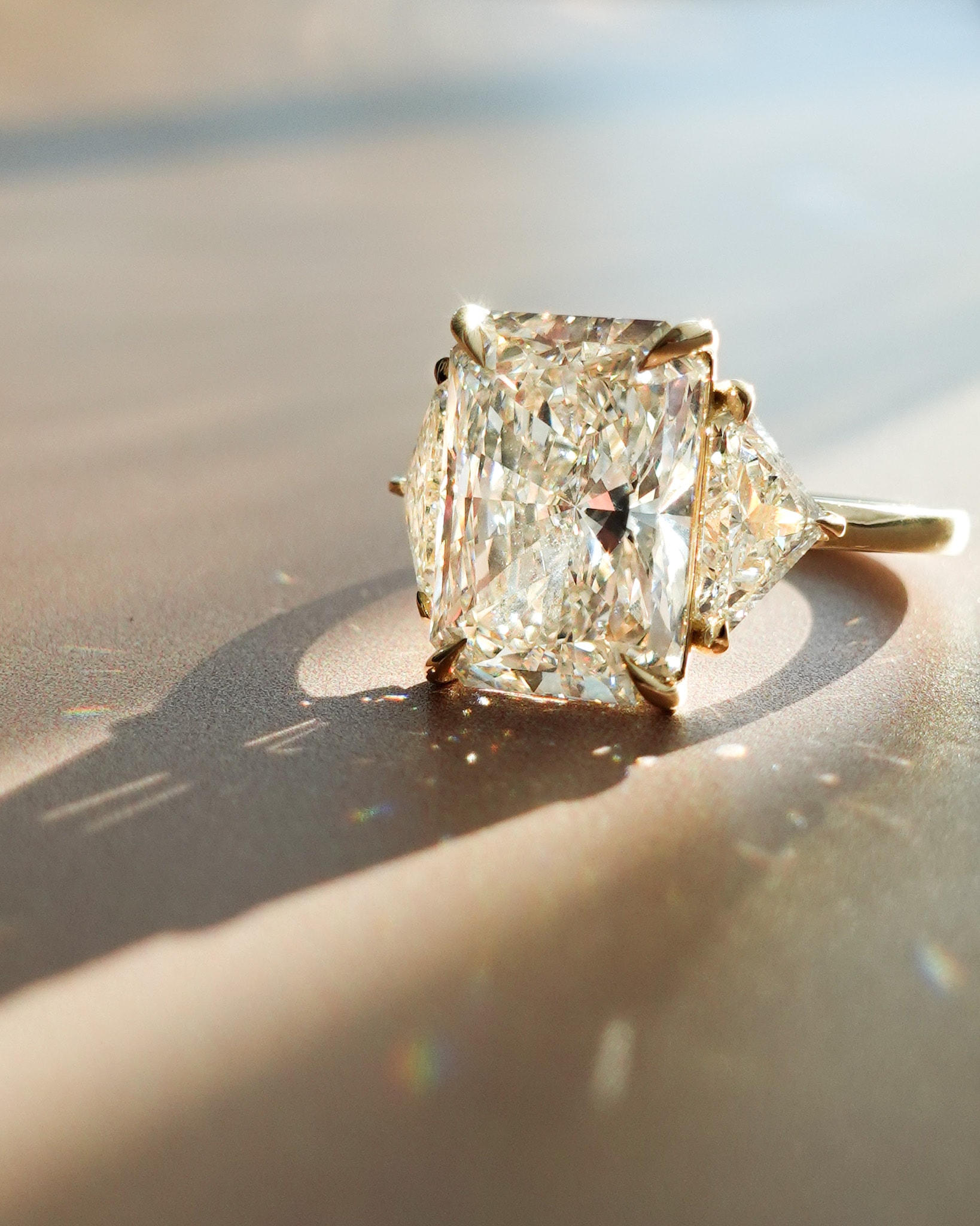 Three Stone Engagement Ring with Shield Side Stones and a Radiant cut Diamond